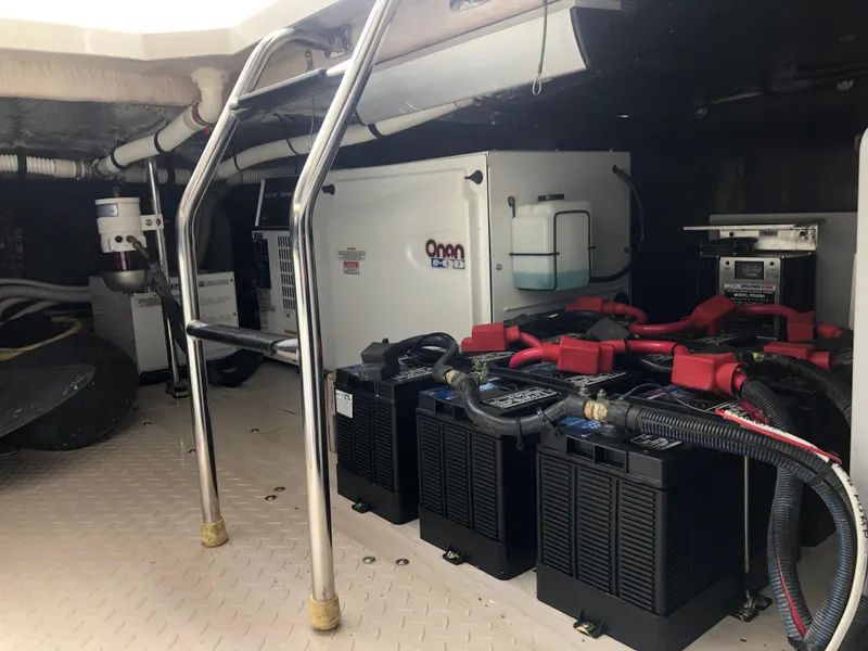 Slide: The Image of Engine room of a 2006 Sea Ray 52 Sedan Bridge yacht with Onan generator and batteries. - 45