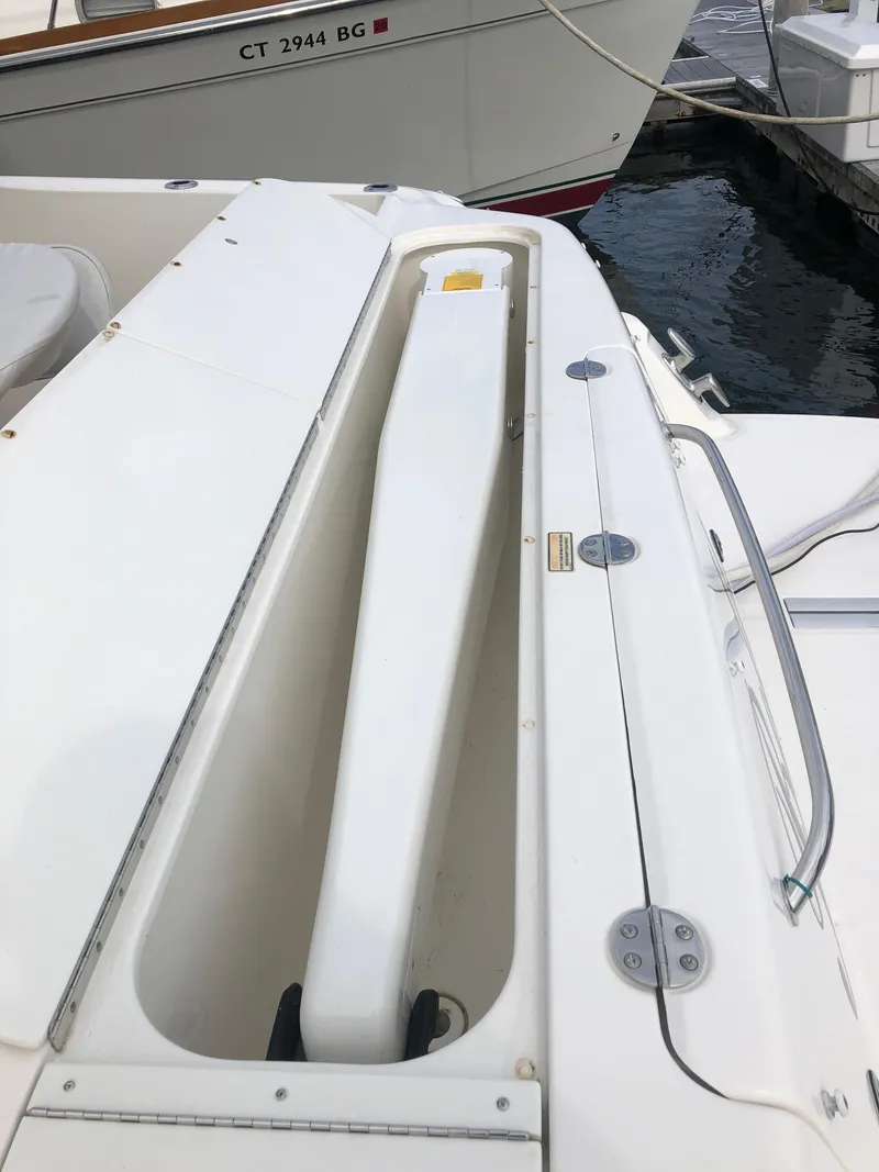 Slide: The Image of 2006 Sea Ray 52 Sedan Bridge boat deck with storage compartment. - 7