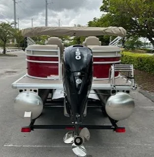 Slide: The Image of 2024 Sun Tracker Party Barge 24 DLX pontoon boat with 150 HP engine, rear view. - 3