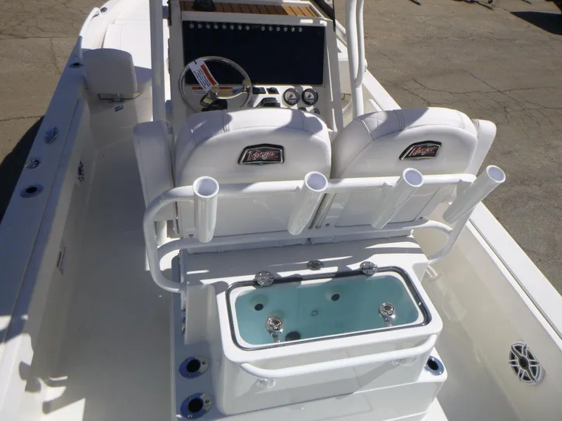 Slide: The Image of 2024 Ranger 2360 Bay boat interior with dual seats and fishing rod holders. - 12
