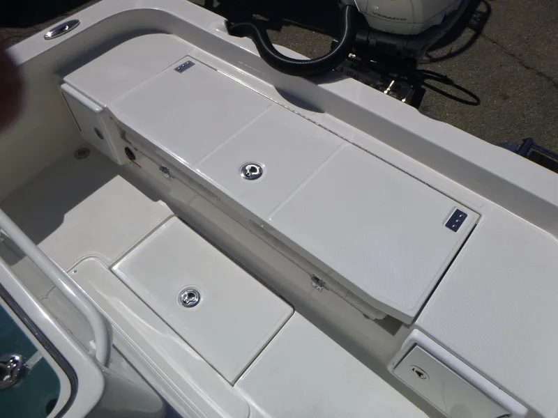 Slide: The Image of 2024 Ranger 2360 Bay boat interior with storage compartments and sleek design. - 13