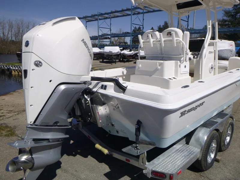Slide: The Image of 2024 Ranger 2360 Bay boat with Mercury outboard engine on trailer. - 4