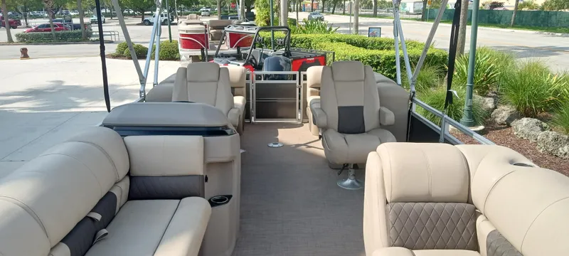 Slide: The Image of 2024 Sun Tracker Party Barge 24 DLX with spacious seating and modern design. - 2