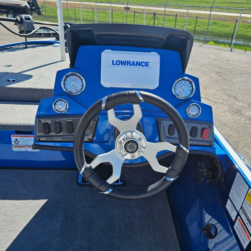 Slide: The Image of 2024 Nitro Z18 Pro boat dashboard with Lowrance electronics and steering wheel. - 15