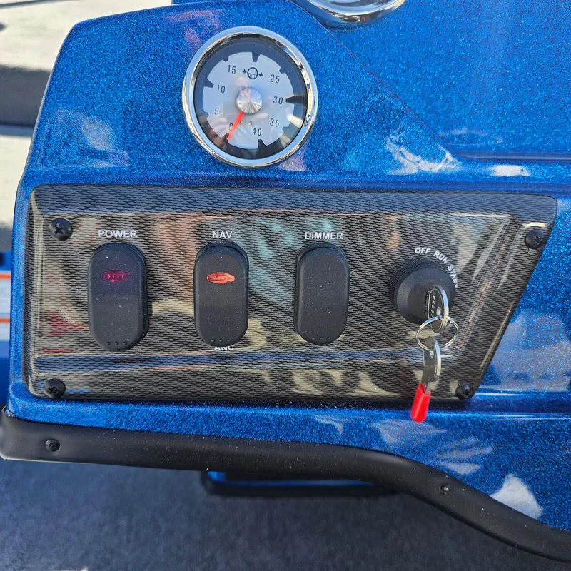 Slide: The Image of Control panel of a 2024 Nitro Z18 Pro boat with power, navigation, and dimmer switches. - 16