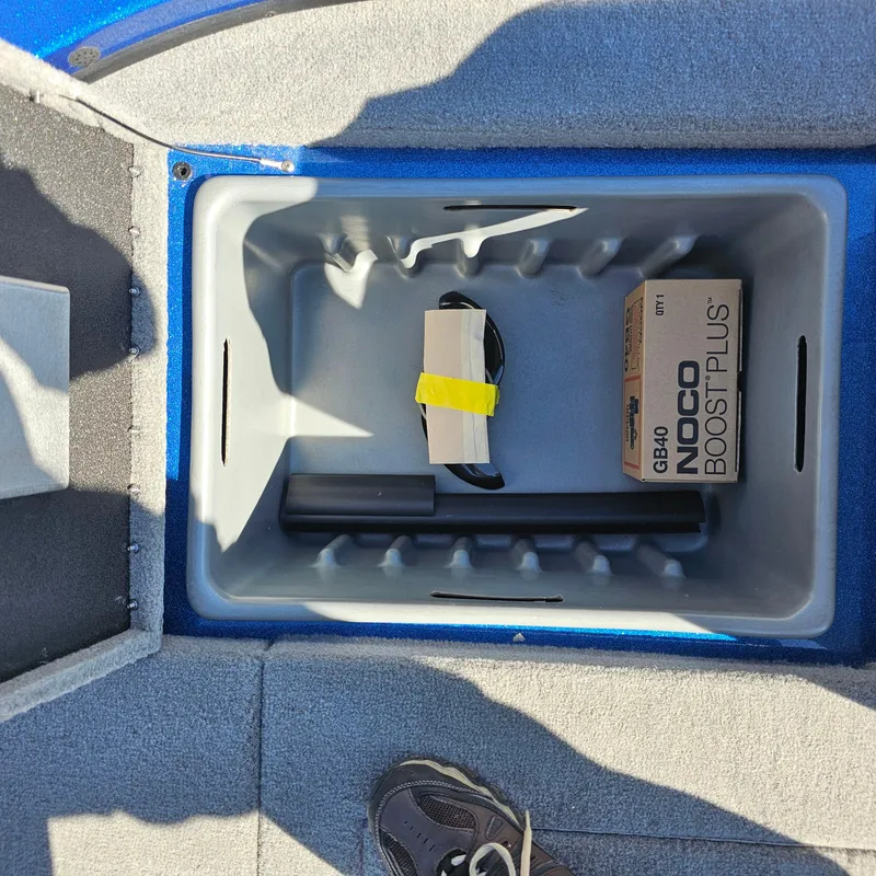 Slide: The Image of Storage compartment of 2024 Nitro Z18 Pro boat with NOCO Boost Plus GB40. - 24