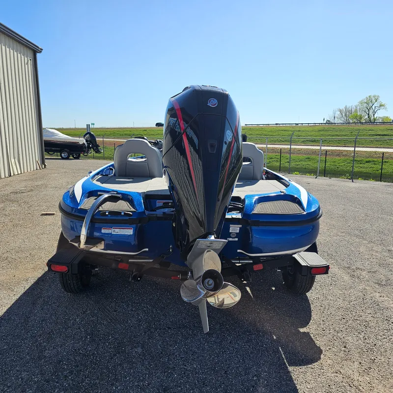 Slide: The Image of 2024 Nitro Z18 Pro boat with powerful outboard motor, parked outdoors. - 3