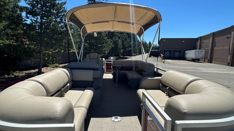 Slide: The Image of 2024 Sun Tracker Party Barge 24 DLX pontoon boat with spacious seating and canopy. - 4