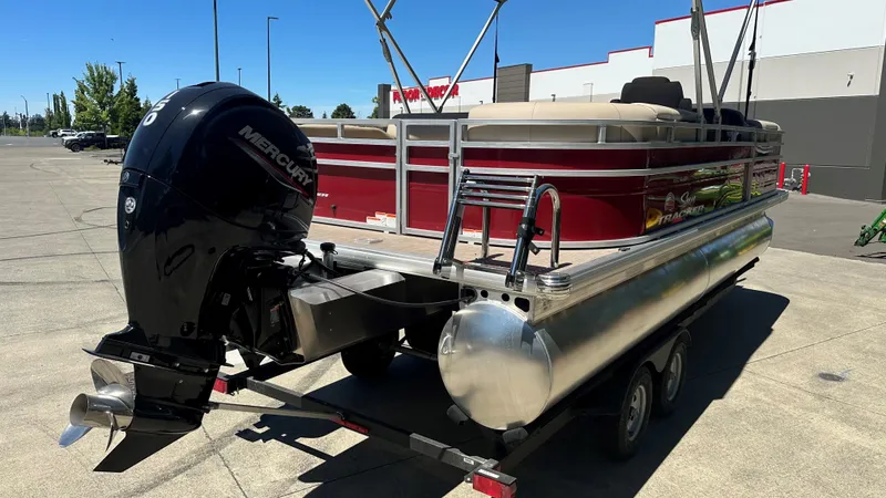 Slide: The Image of 2024 Sun Tracker Party Barge 24 DLX pontoon boat with Mercury outboard motor. - 6