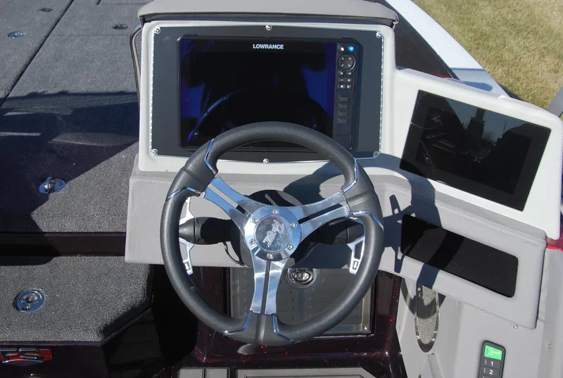 Slide: The Image of 2024 Ranger 620FS Pro boat dashboard with Lowrance electronics and steering wheel. - 10