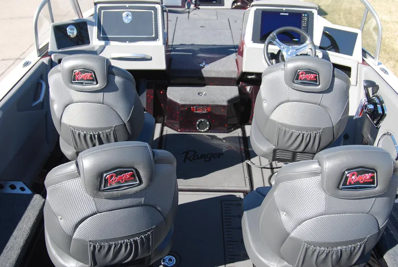 Slide: The Image of 2024 Ranger 620FS Pro boat interior with four seats and modern dashboard. - 13