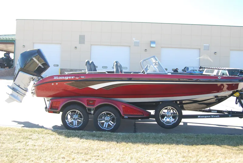 Slide: The Image of 2024 Ranger 620FS Pro boat on a trailer, red and black color scheme. - 6