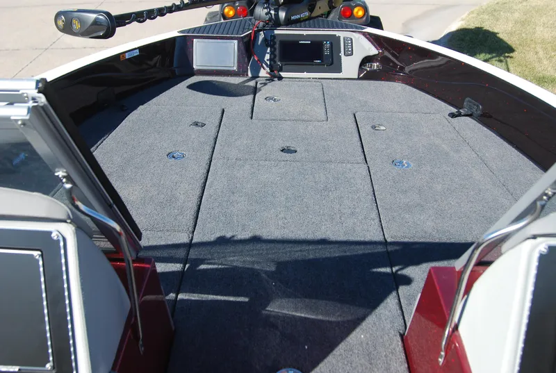 Slide: The Image of 2024 Ranger 620FS Pro boat deck with storage compartments and control panel. - 7