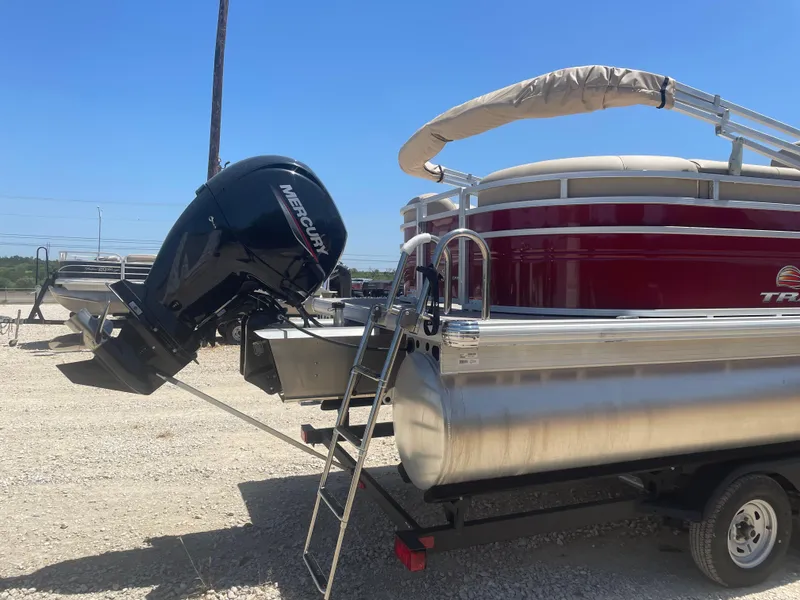 Slide: The Image of 2024 Sun Tracker Party Barge 24 DLX with Mercury outboard engine on trailer. - 3