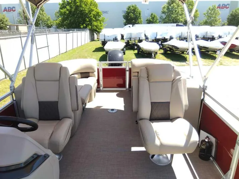 Slide: The Image of 2024 Sun Tracker Party Barge 24 DLX interior with plush seating and spacious layout. - 6