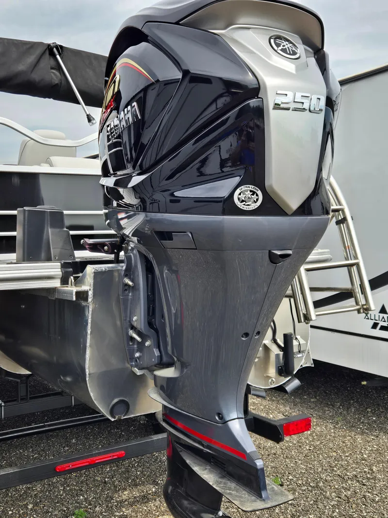 Slide: The Image of 2023 SunCatcher Elite 322 RC boat with powerful Yamaha 250 outboard motor. - 2