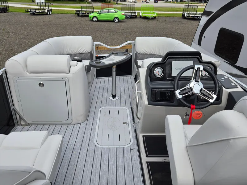 Slide: The Image of 2023 SunCatcher Elite 322 RC pontoon boat interior with plush seating and modern helm. - 5