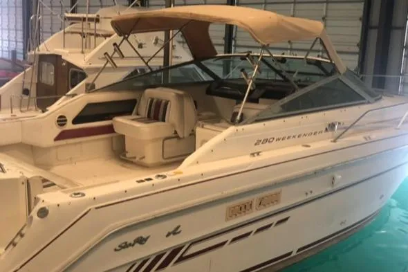 Slide: The Image of 1992 Sea Ray 280 Weekender boat docked in a marina. - 3
