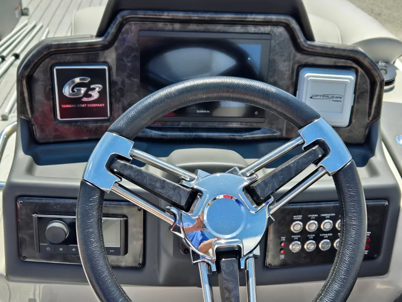 Slide: The Image of 2024 SunCatcher Elite 326 SS dashboard with steering wheel and control panel. - 10