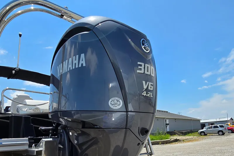 Slide: The Image of 2024 SunCatcher Elite 326 SS with Yamaha 300 V6 engine, outdoor view. - 4