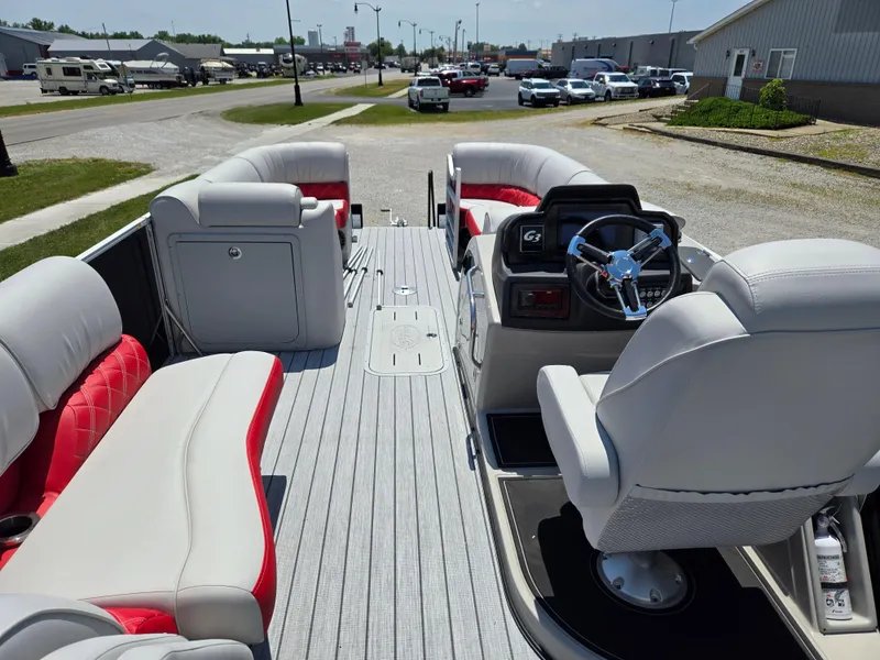 Slide: The Image of 2024 SunCatcher Elite 326 SS pontoon boat with luxurious seating and modern dashboard. - 9
