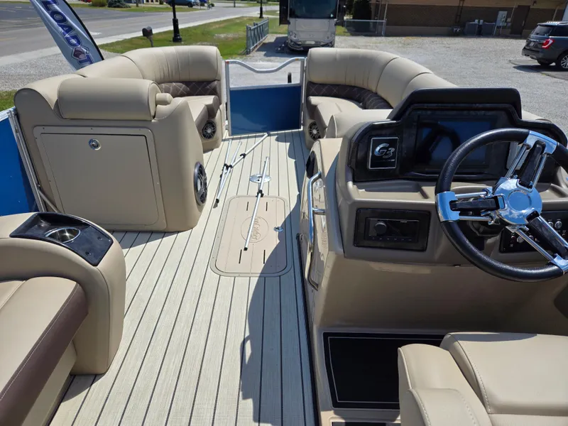 Slide: The Image of 2024 SunCatcher Elite 326 SE pontoon boat interior with luxurious seating and modern dashboard. - 10