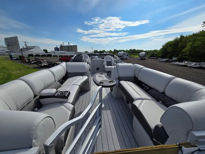 Slide: The Image of 2024 SunCatcher Elite 326 SL pontoon boat with spacious seating and modern design. - 4