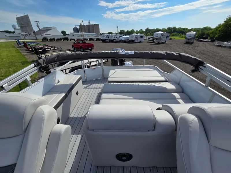 Slide: The Image of 2024 SunCatcher Elite 326 SL pontoon boat with spacious seating and sleek design. - 6
