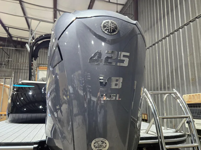 Slide: The Image of 2024 SunCatcher Amara with Yamaha 425 V8 outboard engine in a warehouse setting. - 3