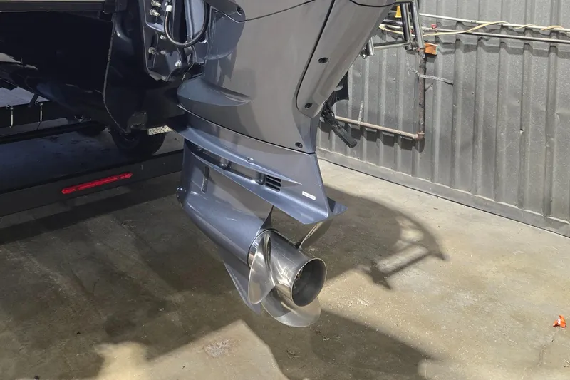 Slide: The Image of 2024 SunCatcher Amara boat motor in a garage setting. - 4