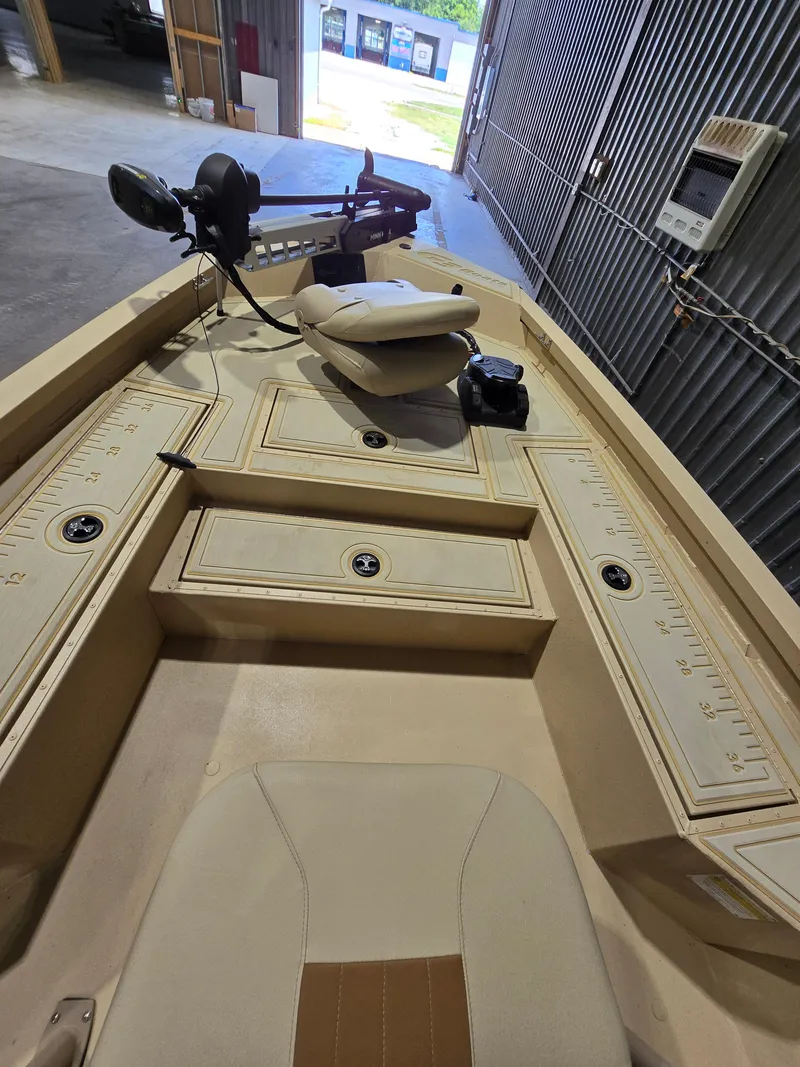 Slide: The Image of 2023 G3 Bay 20 GX boat interior with seating and storage compartments. - 10