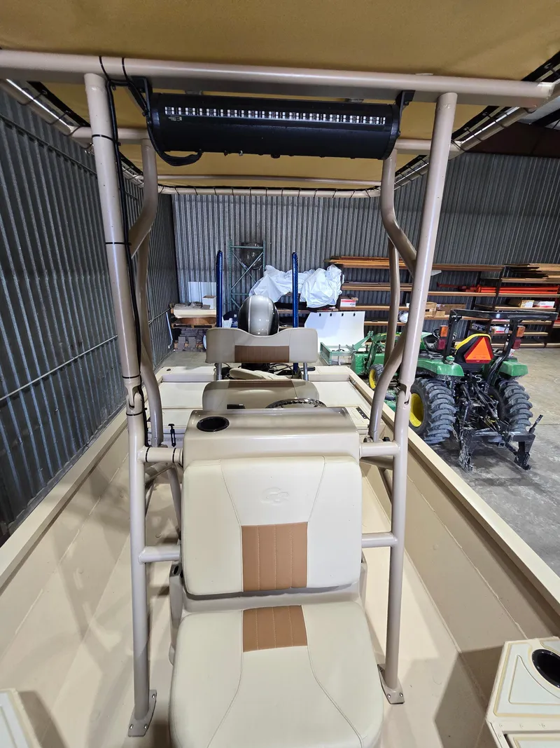 Slide: The Image of 2023 G3 Bay 20 GX boat interior with seating and equipment in a storage area. - 8
