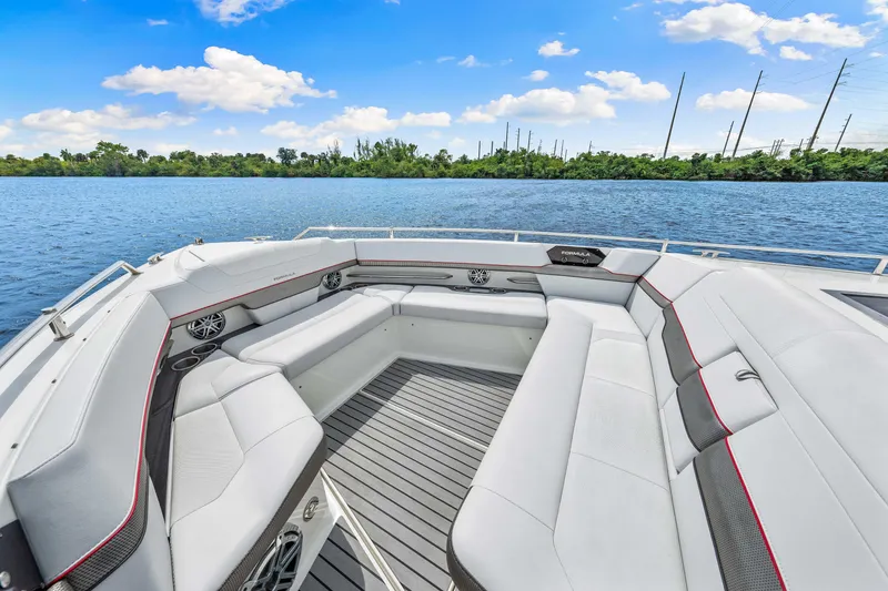 Slide: The Image of 2017 Formula 430 Super Sport Crossover boat with spacious seating on a serene lake. - 46