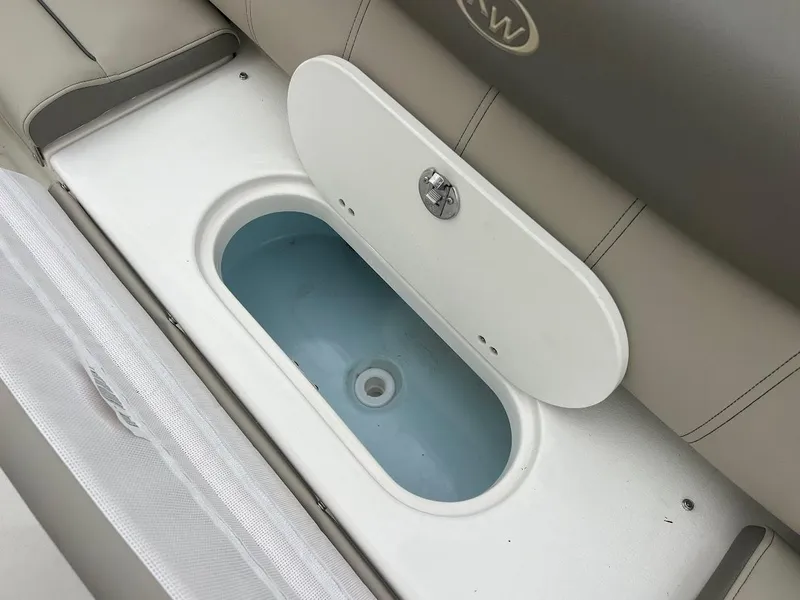 Slide: The Image of Open storage compartment on a 2024 Key West 219 FS boat. - 10