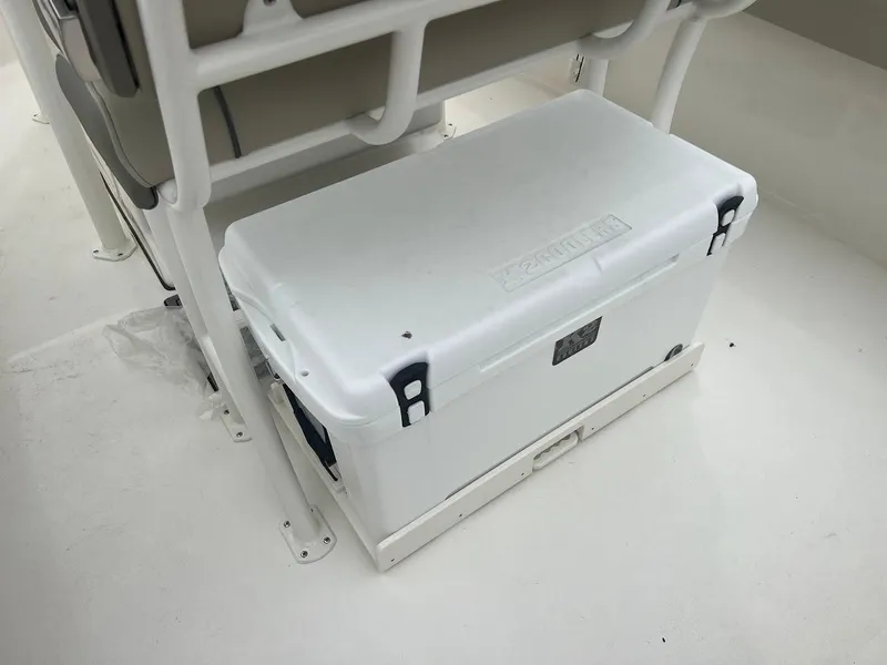 Slide: The Image of White cooler on a 2024 Key West 219 FS boat deck. - 12