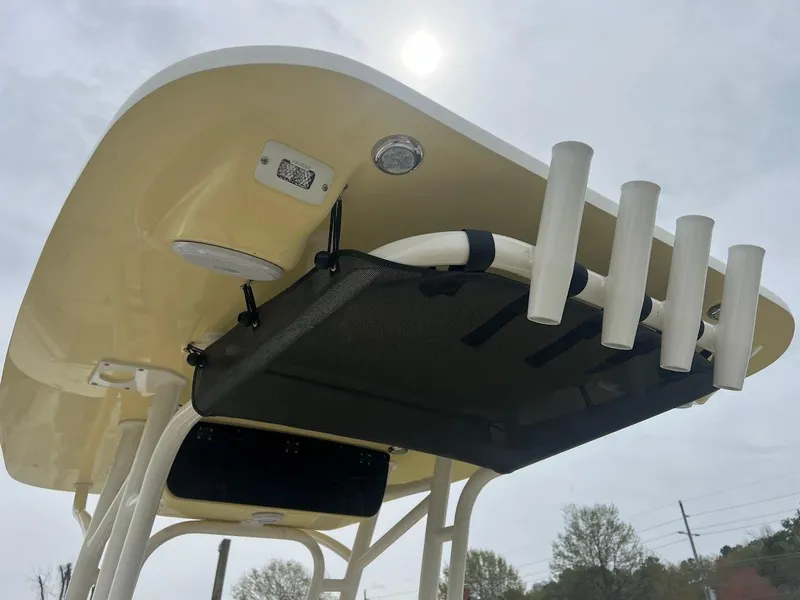 Slide: The Image of 2024 Key West 219 FS boat T-top with rod holders and storage. - 14