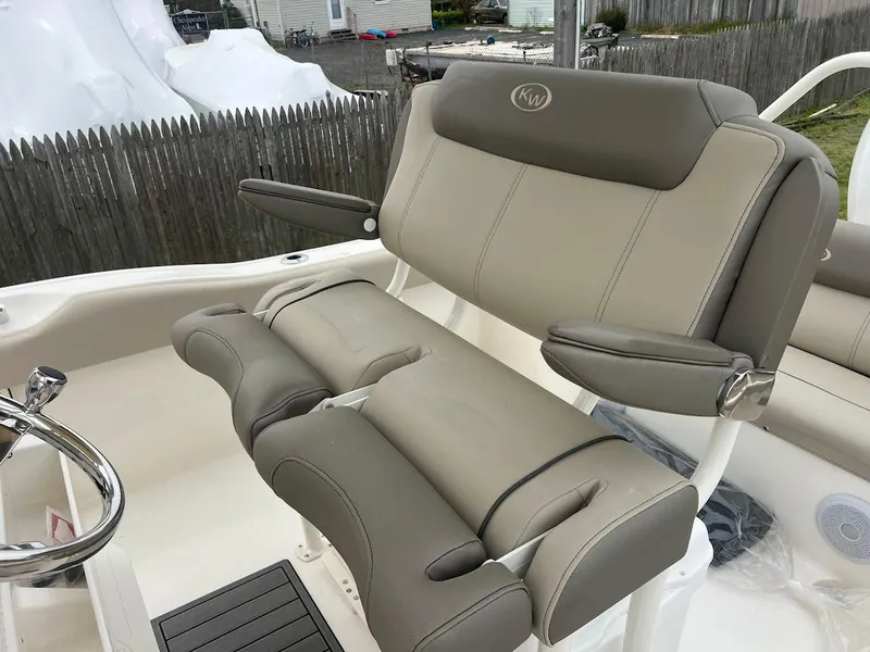 Slide: The Image of 2024 Key West 219 FS boat with comfortable seating and armrests. - 16