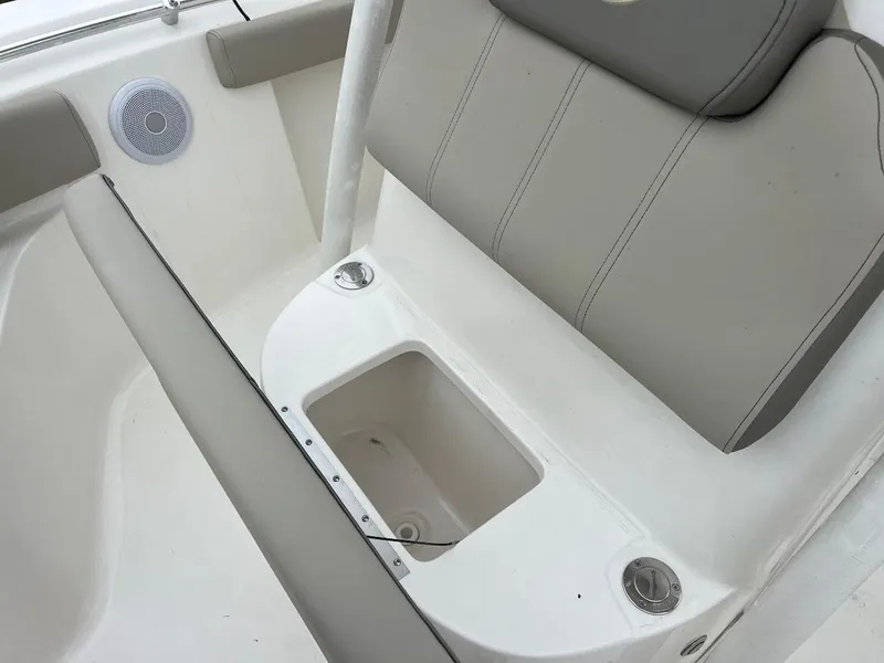 Slide: The Image of 2024 Key West 219 FS boat seat with storage compartment and speaker. - 23