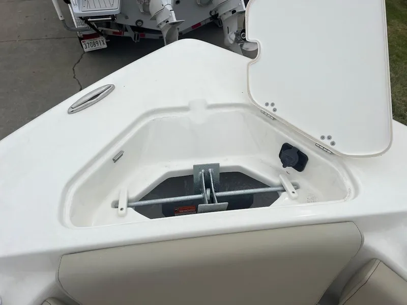Slide: The Image of 2024 Key West 219 FS boat anchor storage compartment with open hatch. - 24