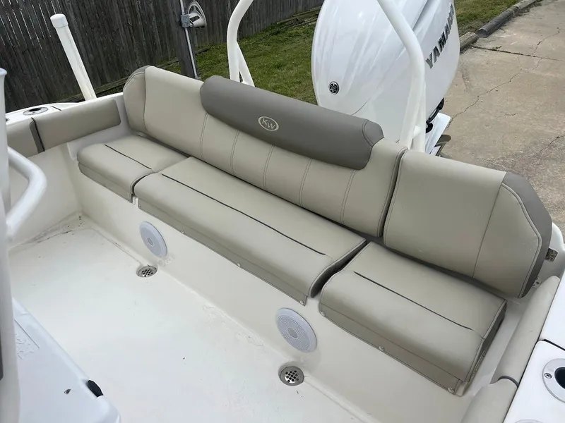 Slide: The Image of 2024 Key West 219 FS boat with beige cushioned seating. - 9