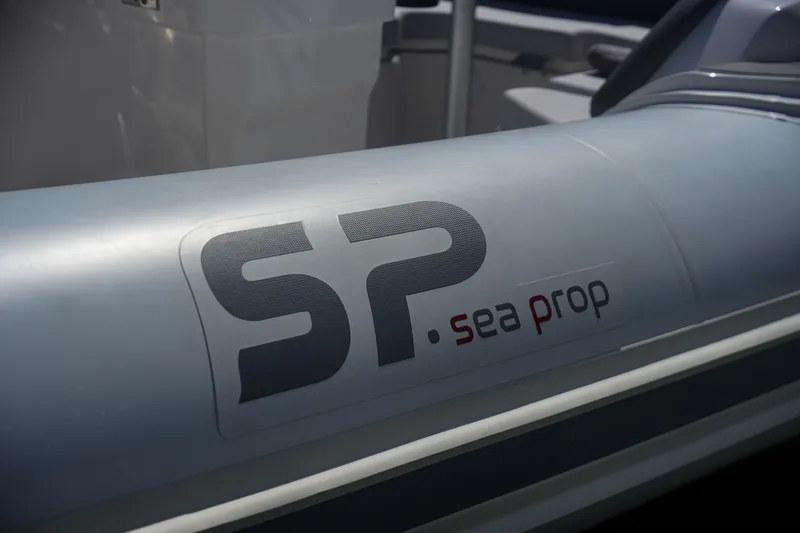 Slide: The Image of Sea Prop COMFORT 24 inflatable boat, 2025 model, close-up of SP logo. - 10