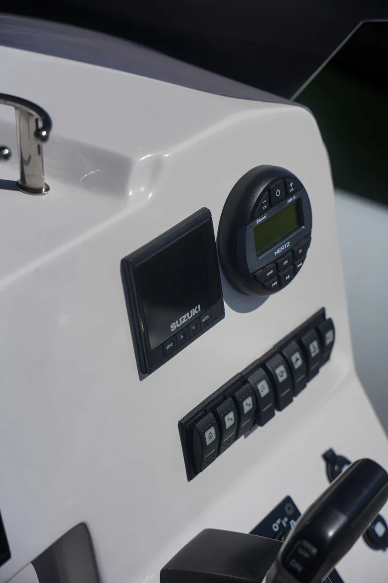 Slide: The Image of Control panel of Sea Prop COMFORT 24 boat, 2025 model, featuring various gauges and switches. - 11