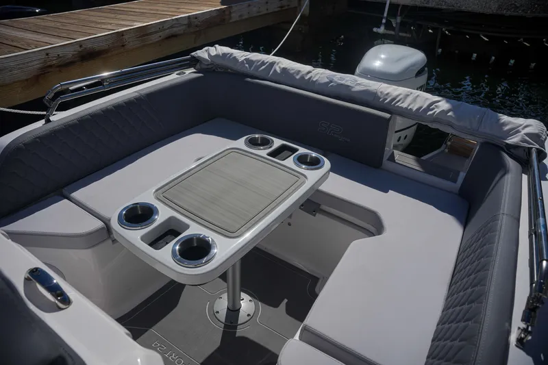 Slide: The Image of 2025 Sea Prop COMFORT 24 boat interior with cushioned seating and table. - 13