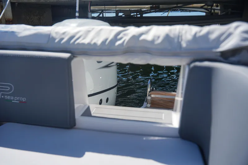 Slide: The Image of Sea Prop COMFORT 24 boat, 2025 model, view of the rear seating and water. - 15