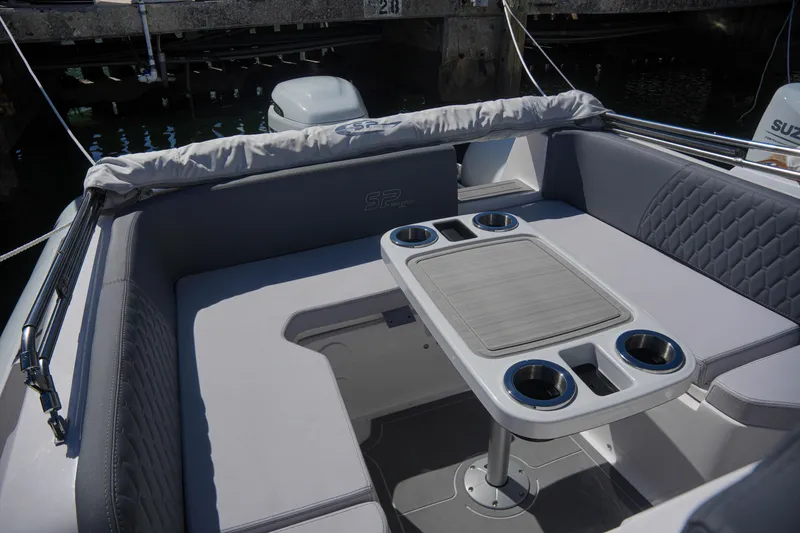 Slide: The Image of Sea Prop COMFORT 24 (2025) boat interior with cushioned seating and table. - 17