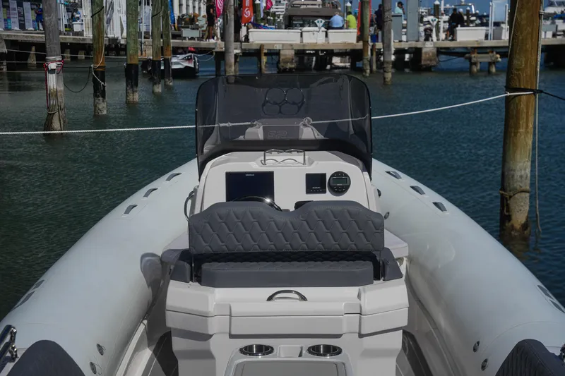 Slide: The Image of 2025 Sea Prop COMFORT 24 boat at marina, featuring modern console and seating. - 19