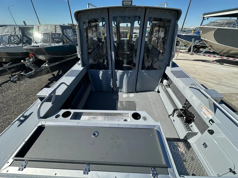 Slide: The Image of 2024 Hewescraft 190 Searunner HT FC boat interior, docked with other boats. - 4