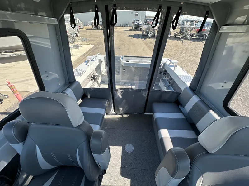 Slide: The Image of Interior of 2024 Hewescraft 190 Searunner HT FC boat with seating and windows. - 9