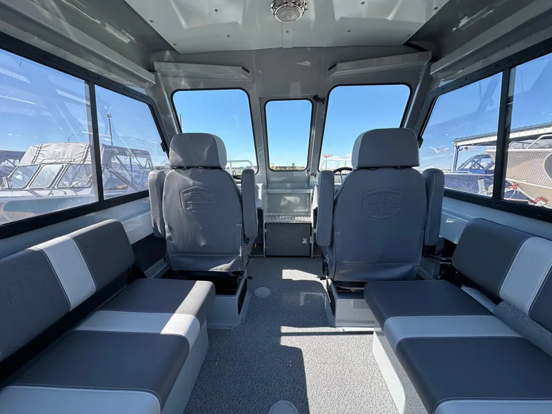 Slide: The Image of 2024 Hewescraft 190 Searunner HT FC interior with seating and windows. - 6
