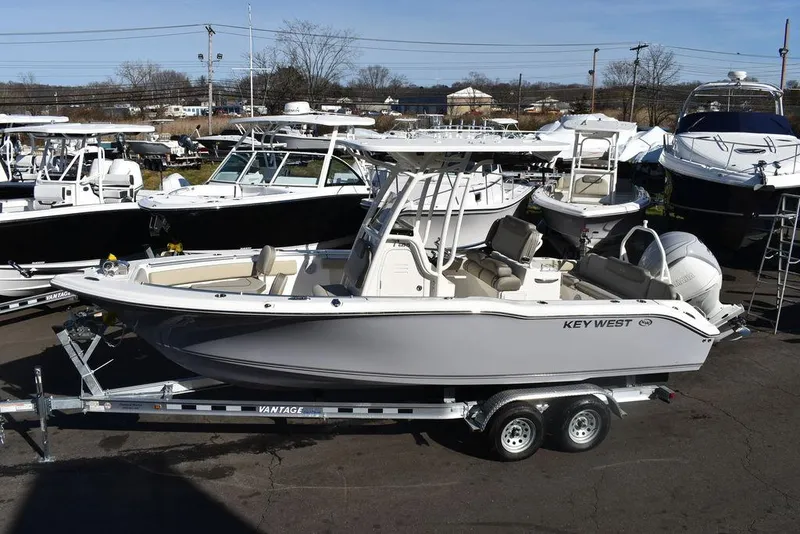 The Image of 2024 Key West 239 FS boat on a trailer in a marina. - 0
